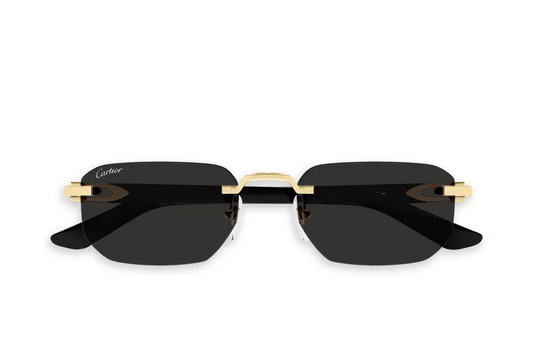 Sunglasses with black lenses and gold frame on a white background